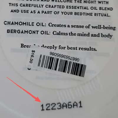 A batch code stamped on the base of a beauty product